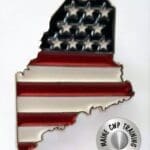 A metal pin with the american flag on it.
