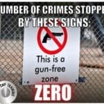 A sign that says, " this is a gun-free zone zero ".
