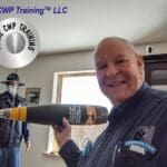 A man holding a champagne bottle in his hand.