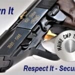 A gun that is being held up to the side of it.